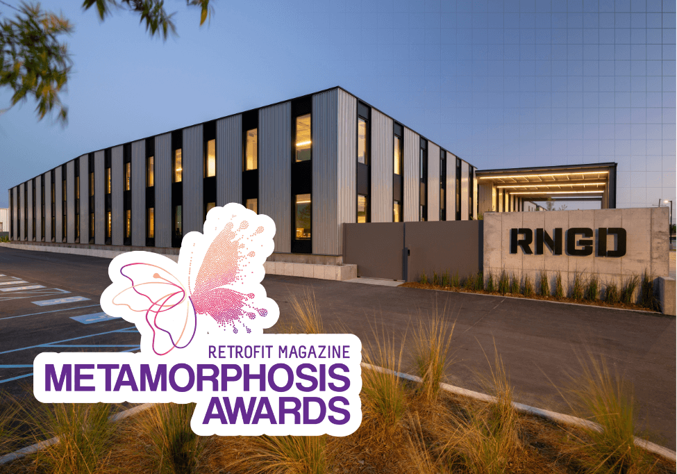 RNGD headquarters exterior with modern facade at sunset, featuring the Retrofit Magazine Metamorphosis Awards logo in the foreground.